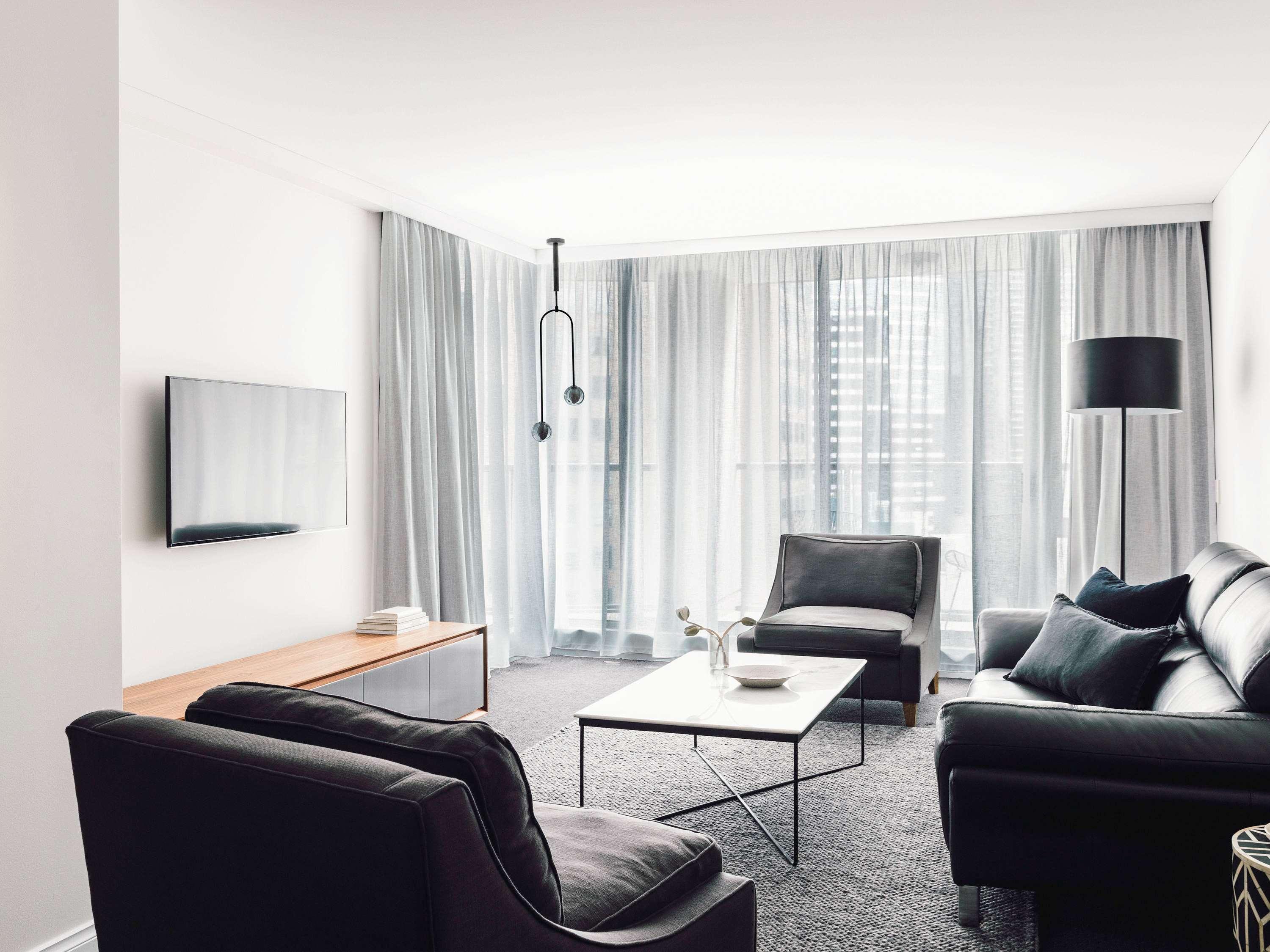 Quay West Suites Melbourne City Exterior foto A living room in a serviced apartment in Berlin, Germany