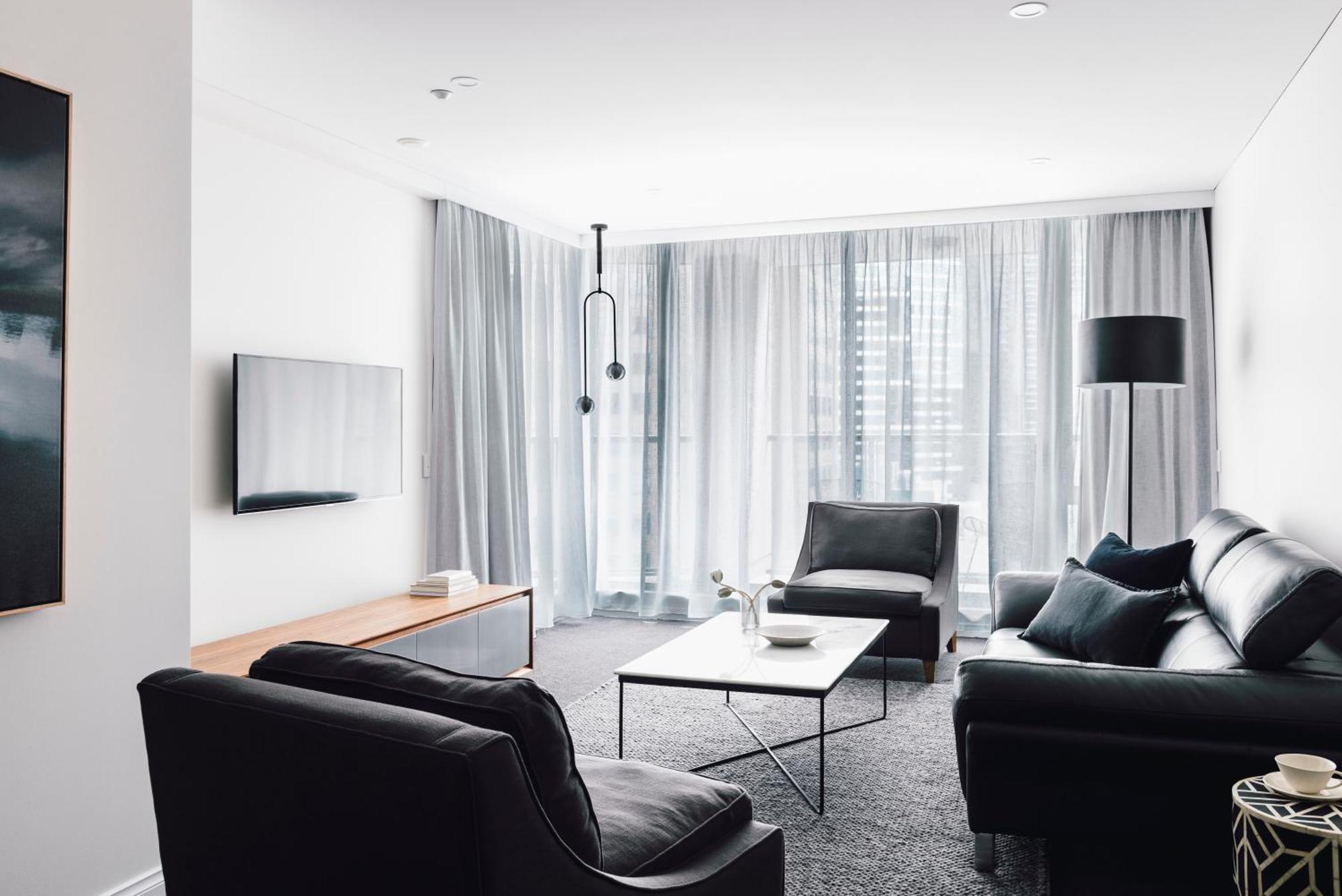 Quay West Suites Melbourne City Exterior foto A living room in a modern apartment